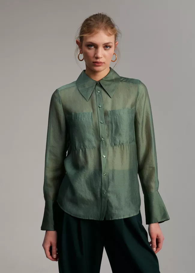 Blusa bolsillos transparencia