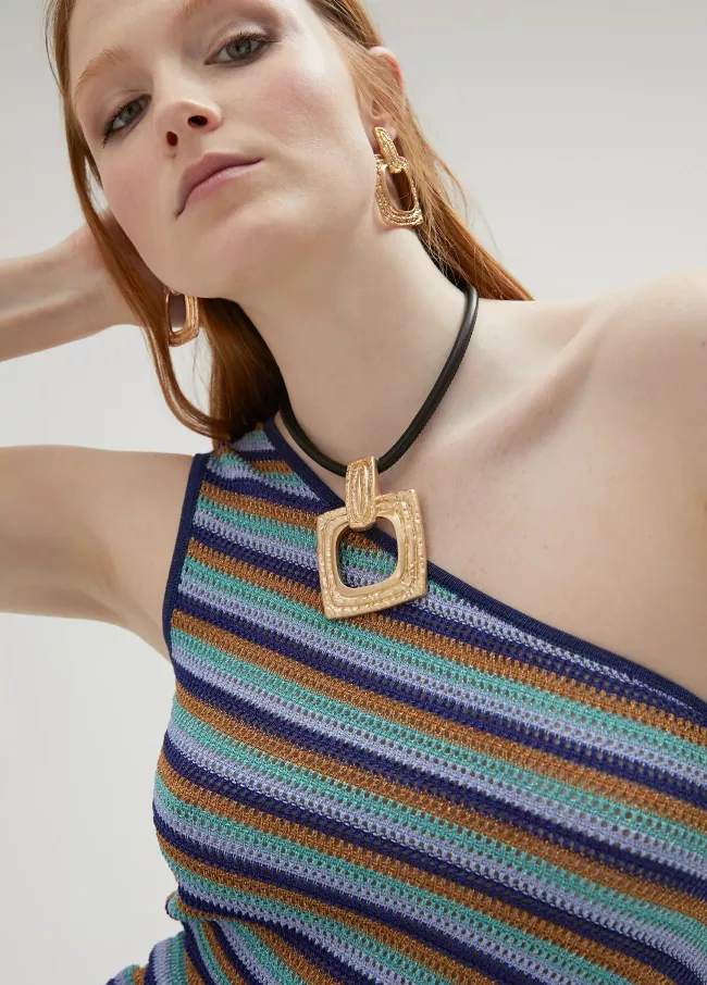 Gold-toned necklace with a black cord.