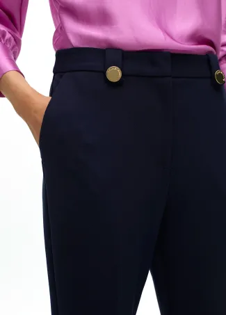 Knitted trousers with buttons