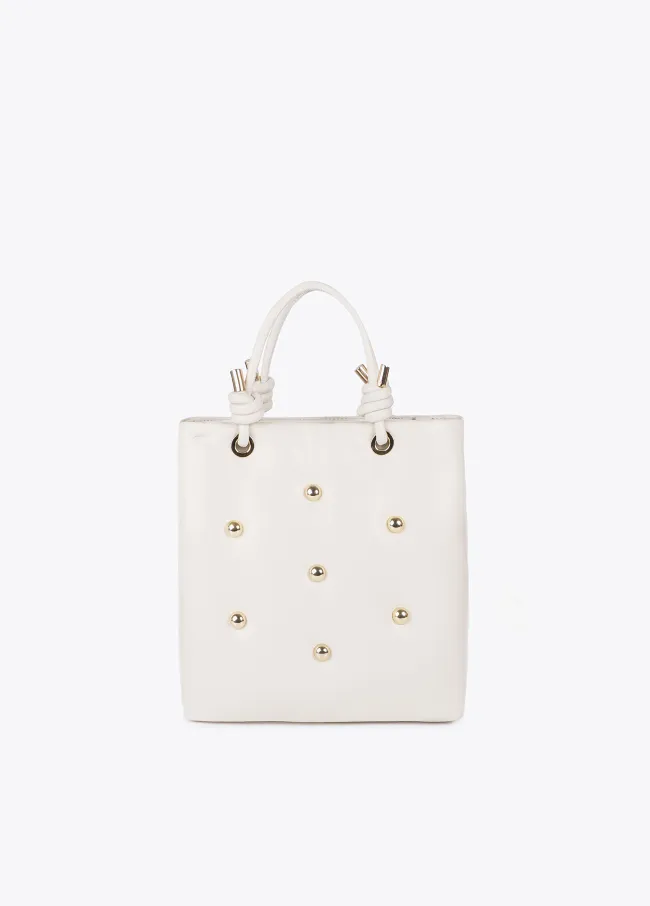 Quilted faux leather bag with round XL studs