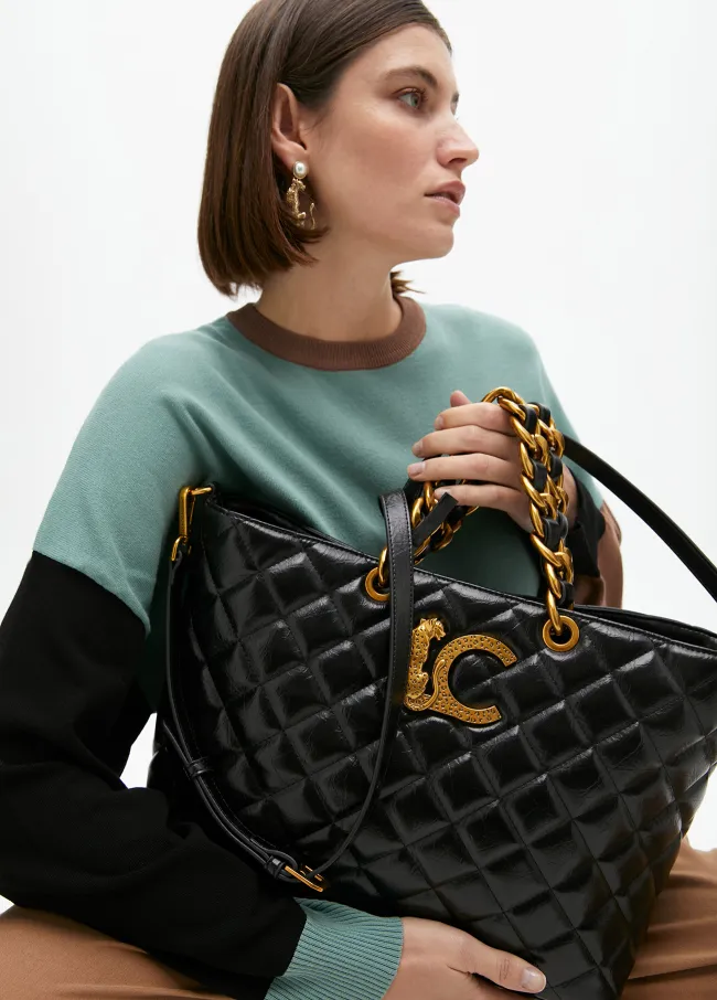 Quilted faux leather tote bag with chain strap...