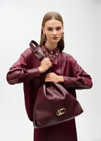 Faux leather tote bag with oval LC logo.