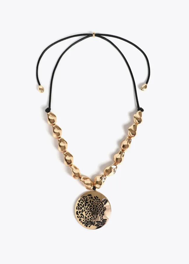 Cord necklace with golden pieces and rhinestone...