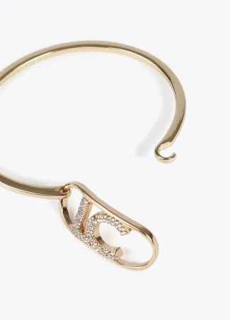 Rigid thin bangle with oval logo
