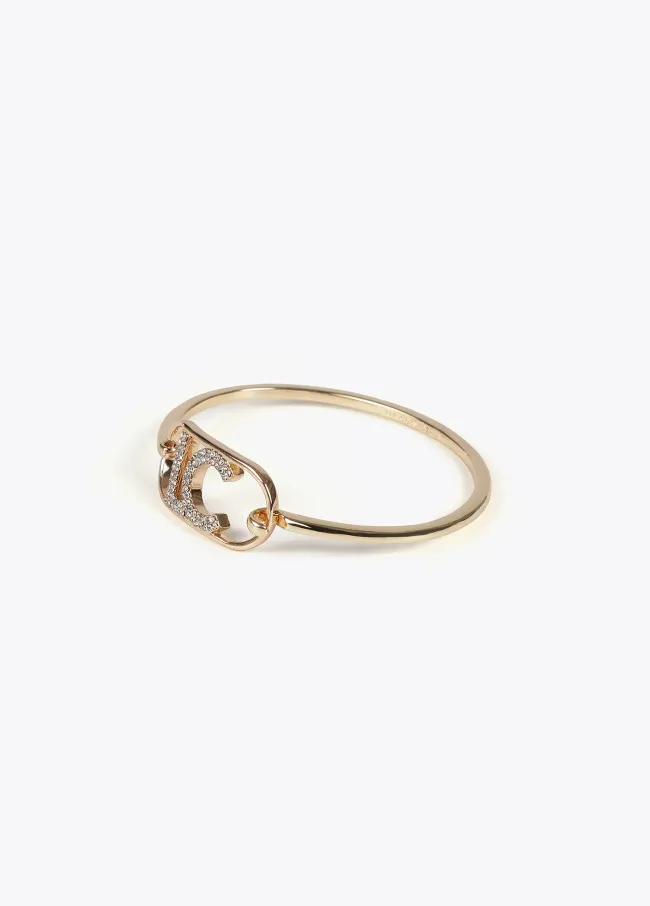 Rigid thin bangle with oval logo