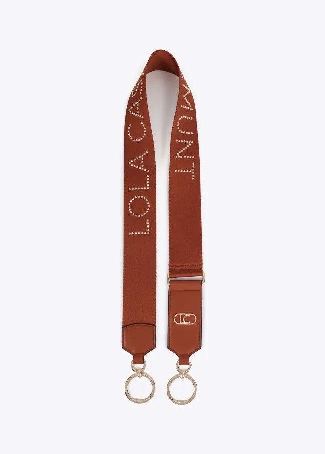 Bag strap with metallic studs and logo