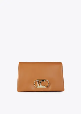 Faux leather crossbody bag with three compartments and flap.