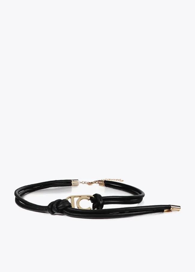 Faux leather strappy belt with oval logo