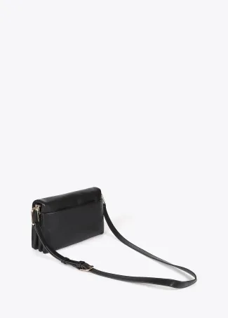 Faux leather crossbody bag with three compartments and flap.