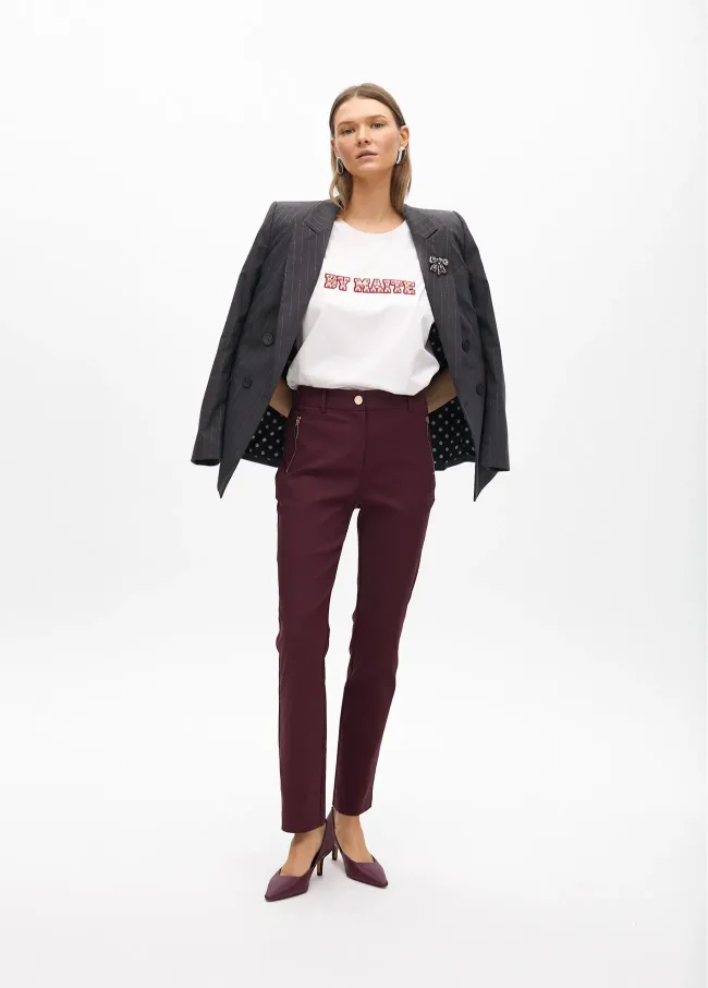 Stretch fabric trousers with zipped pocket