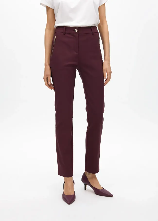 Stretch fabric trousers with zipped pocket