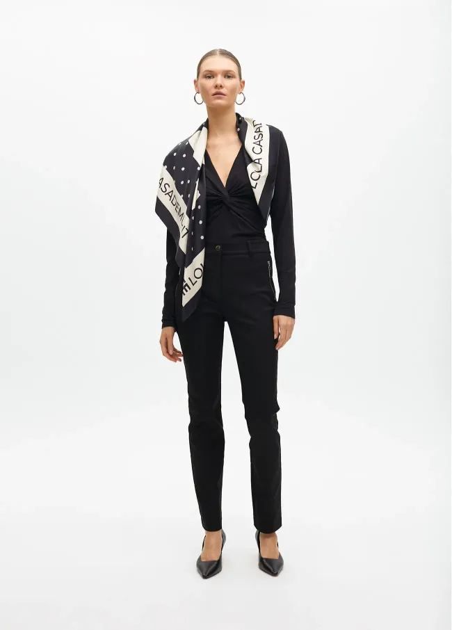 Stretch fabric trousers with zipped pocket