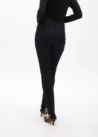 Stretch fabric trousers with zipped pocket