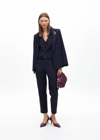 Stretchy chinos with rhinestone logos