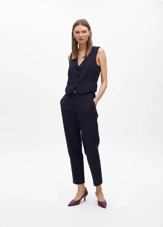 Stretchy chinos with rhinestone logos