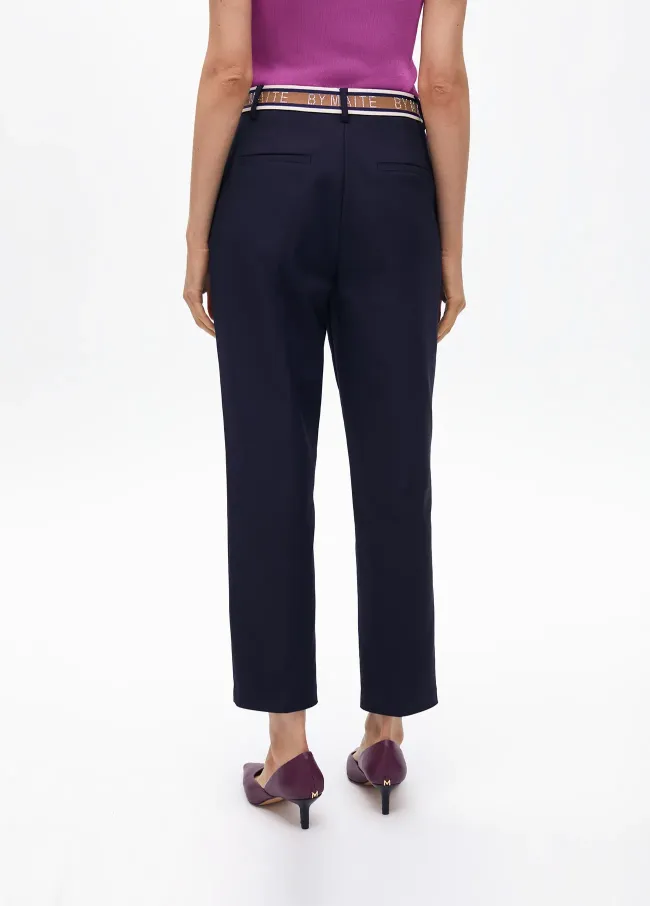 Stretchy chinos with rhinestone logos