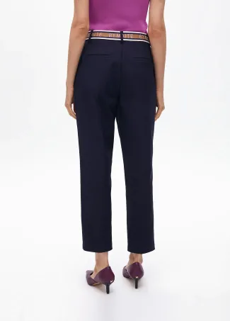 Stretchy chinos with rhinestone logos