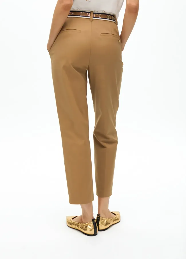 Stretchy chinos with rhinestone logos