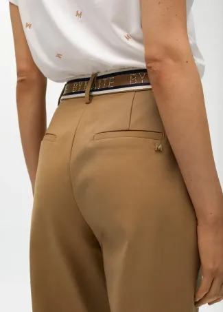 Stretchy chinos with rhinestone logos