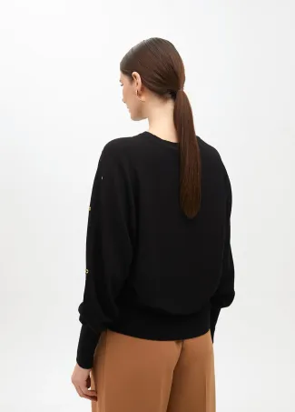 Drop sleeve sweater with eyelets