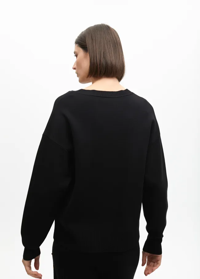 Deconstructed sweater with stud details