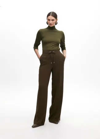 Straight trousers with elastic and central rib
