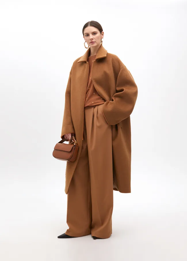 Drop sleeve sweater with eyelets