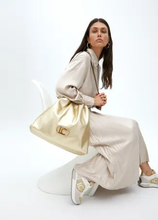 Faux leather tote bag with oval LC logo.