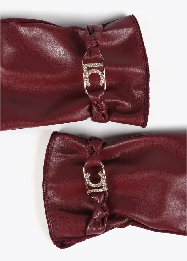 Faux leather gloves with wrist strap with oval...