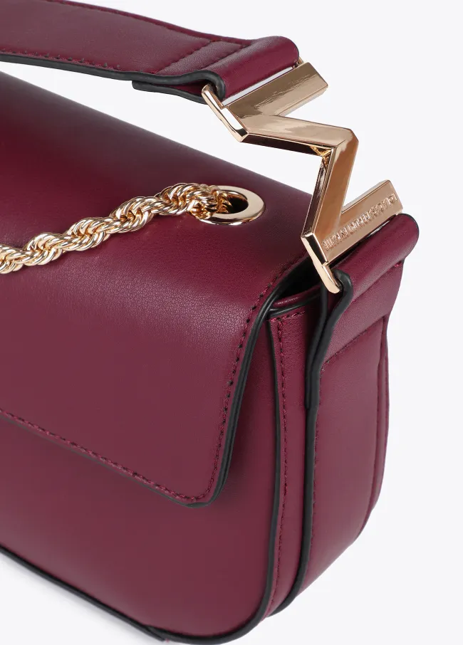 Crossbody bag with faux leather flap and M logo...