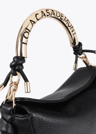 Cutwork crossbody bag with metal handle