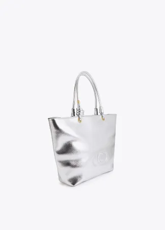 Gold-toned deconstructed tote bag with raised oval logo