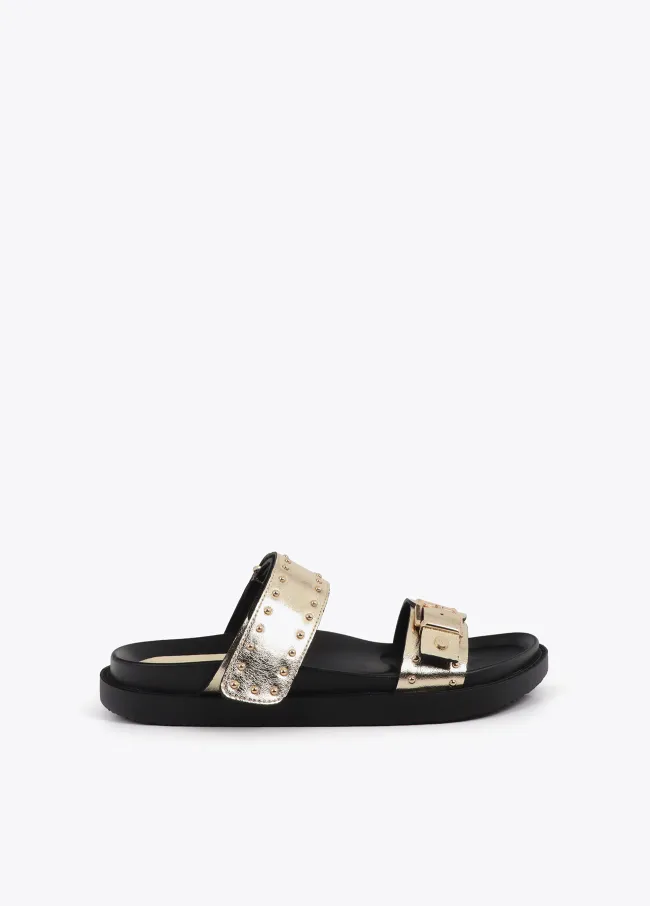 Flat sandals with straps and metal details