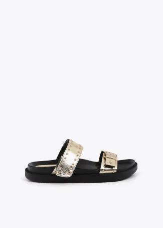 Flat sandals with straps and metal details