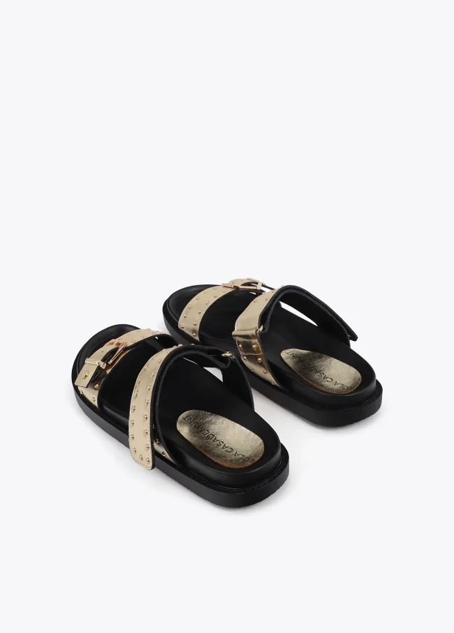 Flat sandals with straps and metal details