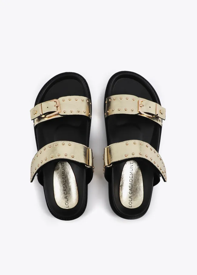 Flat sandals with straps and metal details