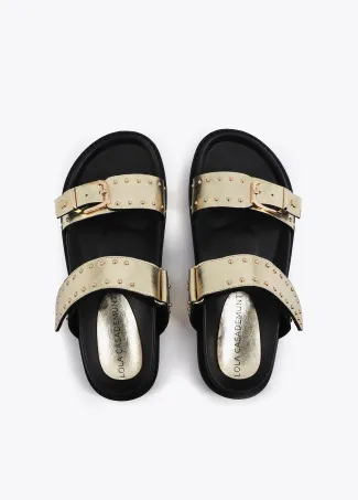 Flat sandals with straps and metal details