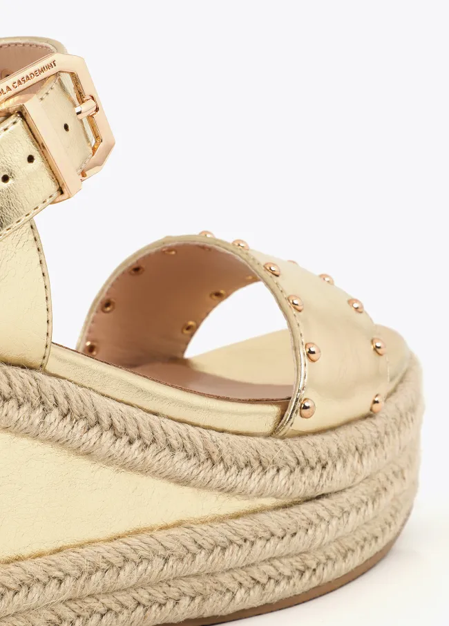 Wedges with raffia-effect sole and metal details