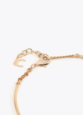 Short rigid choker necklace with contrast animal print and striped pendant