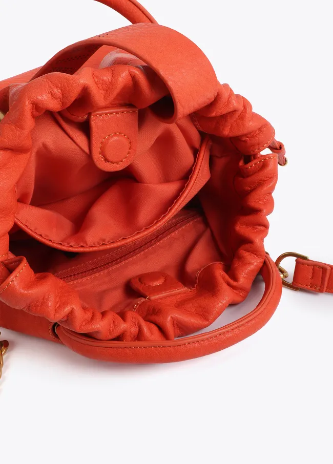 Faux leather bag with round metal handle