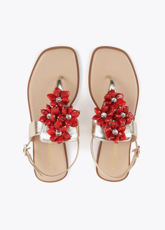 Metallic flat sandals with floral details