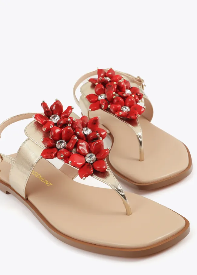 Metallic flat sandals with floral details