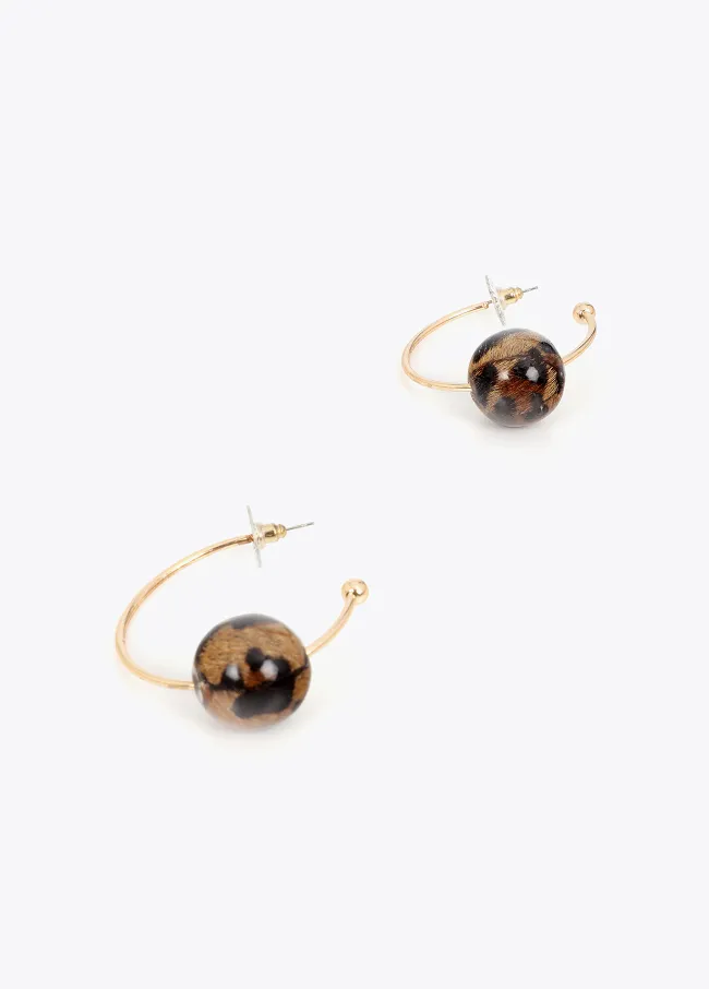 Hoop earrings with maxi animal print ball