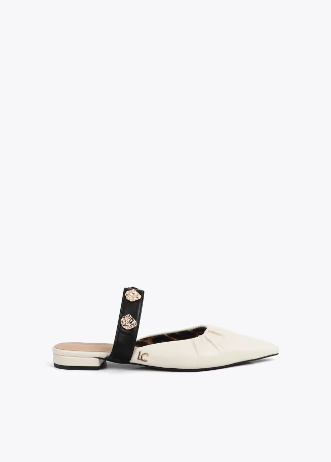 Flat shoes with elasticated detail and metallic appliqués