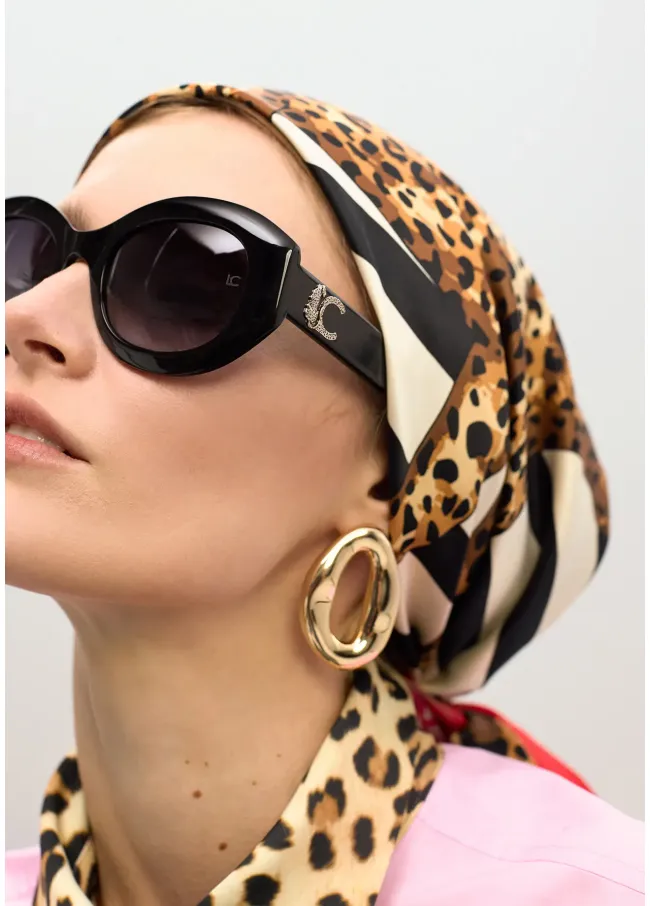 Round sunglasses with leopard logo