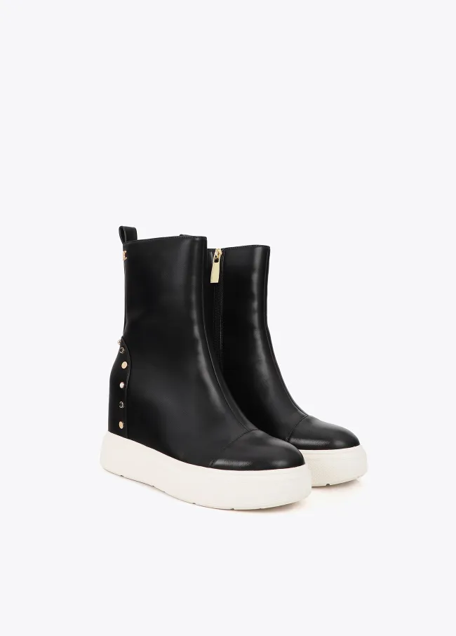 Platform ankle boot with inner wedge studs on heel